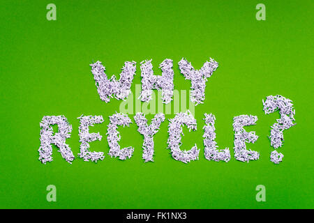 why recycle question made from shredded paper on green background Stock Photo