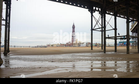 Central Pier, Blackpool.  Taken from underneath to show the structural build.  Blackpool Tower can be seen. Stock Photo