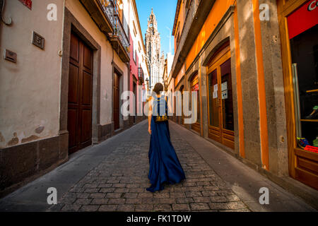 AGAETE, GRAN CANARIA island, SPAIN - DECEMBER 13, 2015: Female tourist in long skirt walking old town in Arucas city on Gran Can Stock Photo