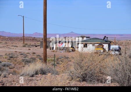 navajo reservation arizona indian housing desert shacks car scrubland poverty native american Stock Photo