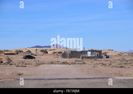 navajo reservation arizona indian housing desert shacks car scrubland poverty Stock Photo