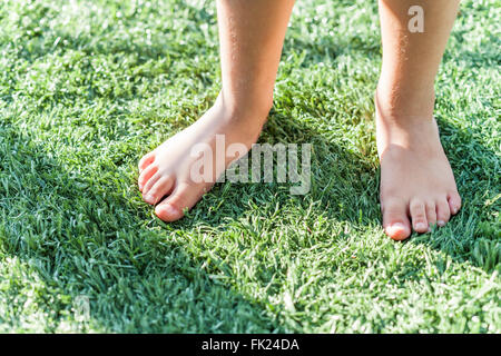 VENICE, CA – AUGUST 19: Glen Irani and son Marlo Irani relax on their artificial grass in Venice, California on August 19, 2005. Stock Photo