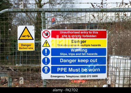 Health and Safety and waring signs on the perimeter of Housing construction site in Bicester, Oxfordshire, England Stock Photo