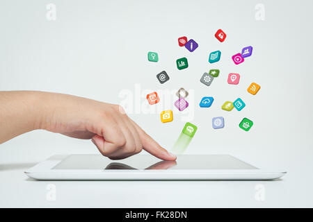 application icons fly off the tablet computer in hand Stock Photo