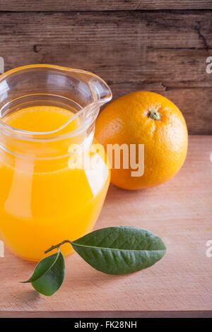 Glass of orange juice on wooden table, fresh drink Stock Photo