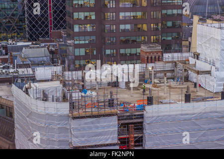 Construction worker on a rooftop Stock Photo