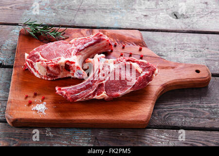 veal lamb steak on the bone of raw cutlets Stock Photo