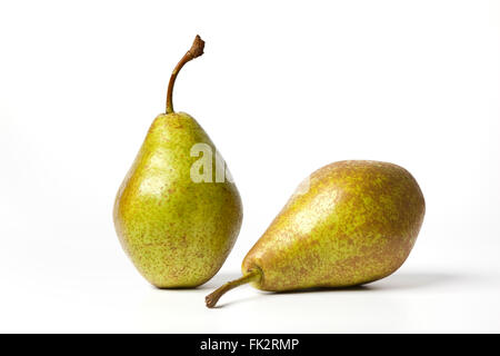 Two fresh ripe whole pears Triomphe de Vienne on white background Stock Photo