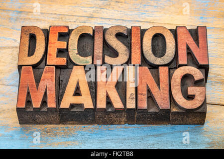 decision making word abstract  in vintage letterpress wood type printing blocks stained by color inks Stock Photo