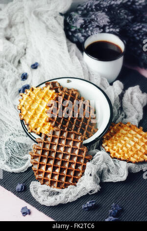 Waffles with Chocolate Icing with Coffee and Lavender Sweets Served in Old-fasioned Tableware. Selective Focus. Stock Photo