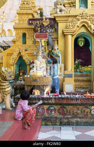 Temples around the Buddhist Schwedagon pagoda Stock Photo