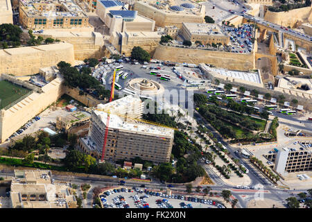 Aerial view of Valletta bus station, with the new city gate and renovation of the Phoenicia Hotel. Stock Photo