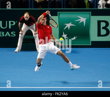 Britain's Andy Murray hits from the baseline against Ukraine's Illya ...