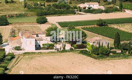 Farms Fields of the South of France. Sunny summer day. Agricultural landscape concept. Panorama. Stock Photo