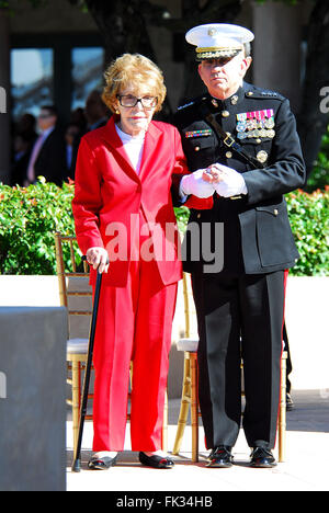 March 6, 2016 - NANCY REAGAN, Ronald Reagan's widow and First Lady from 1981-1989, has died at 94. The cause of death was congestive heart failure. Pictured: Feb. 6, 2011 - Simi Valley, California, U.S. - Former US first lady NANCY REAGAN is escorted by Marine Corps Lieutenant General GEORGE J. FLYNN at the memorial site which serves as her husband's final resting place to lay a wreath during the centennial birthday celebration for former US president Ronald Reagan at the Reagan Presidential Library. (Credit Image: © Valerie Nerres/ZUMAPRESS.com) Stock Photo