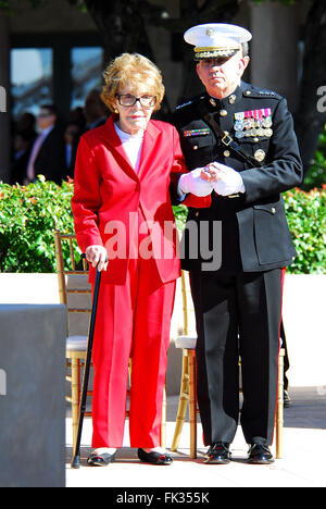 March 6, 2016 - NANCY REAGAN, Ronald Reagan's widow and First Lady from 1981-1989, has died at 94. The cause of death was congestive heart failure. Pictured: Feb. 6, 2011 - Simi Valley, California, U.S. - Former US first lady NANCY REAGAN is escorted by Marine Corps Lieutenant General GEORGE J. FLYNN at the memorial site which serves as her husband's final resting place to lay a wreath during the centennial birthday celebration for former US president Ronald Reagan at the Reagan Presidential Library. © Valerie Nerres/ZUMAPRESS.com/Alamy Live News Stock Photo