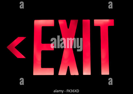Lit Red Exit Sign pointing to the Left Stock Photo