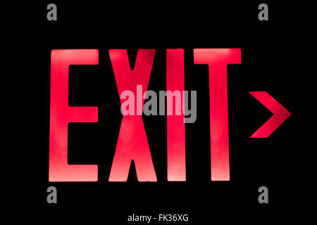 Lit Red Exit Sign pointing to the Right Stock Photo