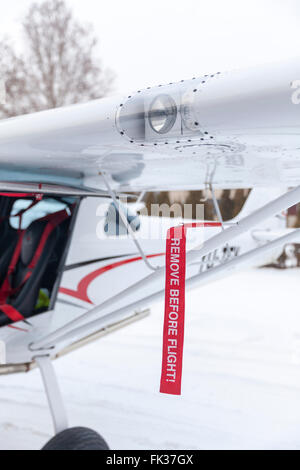remove before flight on small airplane Stock Photo