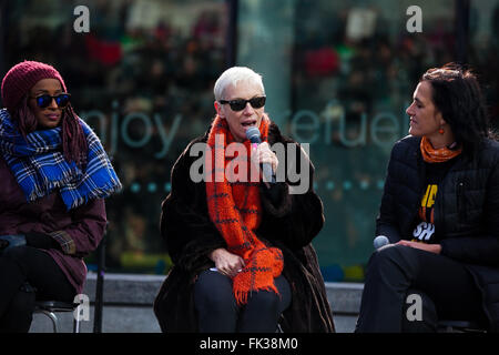 The Scoop at More London, UK 6 March 2016 Annie Lennox addresses during 'Walk in Her Shoes' march. Suffragettes, celebrities and politicians gather on a Mother's Day 'Walk In Her Shoes' march organised by charity CARE International UK as part of solidarity with women and girls worldwide who suffer disproportionately from poverty and discrimination. Stock Photo