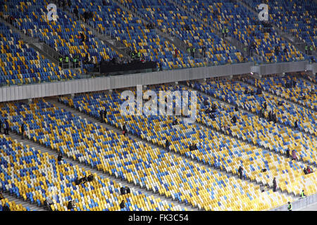 KYIV, UKRAINE - NOVEMBER 11, 2011: People fill the tribunes at the Olympic stadium (NSC Olimpiysky) before friendly football game between Ukraine and Germany on November 11, 2011 in Kyiv, Ukraine Stock Photo