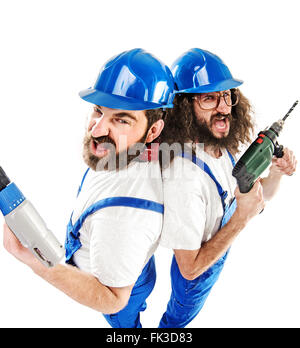 Conceptual picture of two antagonistic builders while working Stock Photo