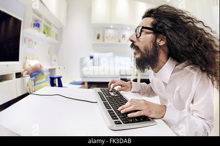 Computer specialist working in a bright office Stock Photo