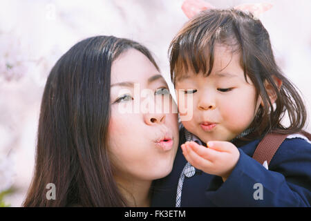 Japanese mom and daughter enjoying the cherry blossoms Stock Photo - Alamy