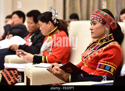 Beijing, China. 7th Mar, 2016. Lin Meijuan (1st R), a duputy to China's 12th National People's Congress (NPC), attends a plenary meeting of deputies from Hainan Province to the fourth session of the 12th NPC in Beijing, capital of China, March 7, 2016. © Liu Junxi/Xinhua/Alamy Live News Stock Photo