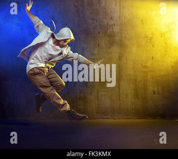 Athletic b-boy dancing a hip hop Stock Photo