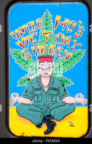 War and peace show, England. Vietnam war re-enactment. Sign, stoned American GI smoking pot, 'Uncle Ho's Victory Garden' Stock Photo