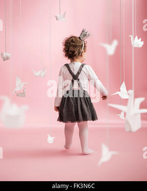 Cute baby walking in the toy room Stock Photo