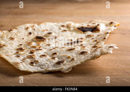 Large thin pita bread over wooden background Stock Photo