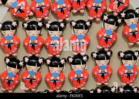 Japanese Cherry Blossom celebration doll refrigerator magnets on display at gift store - USA Stock Photo