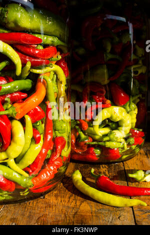 Traditional Jarred yellow, green, red, hot peppers. High resolution ...