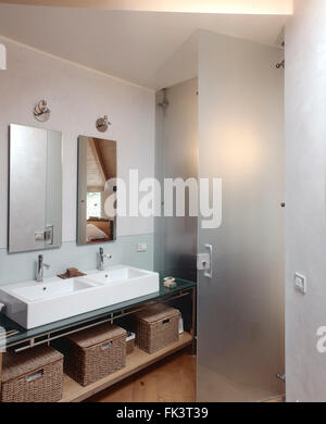 interior view of a modern bathroom in the attic room in foreground two washbasin Stock Photo