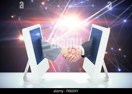 Composite image of handshake between two business people Stock Photo