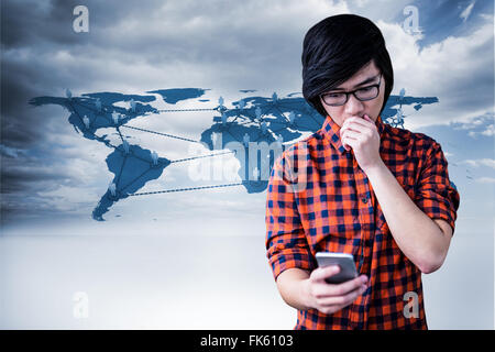 Composite image of surprised hipster watching his phone Stock Photo