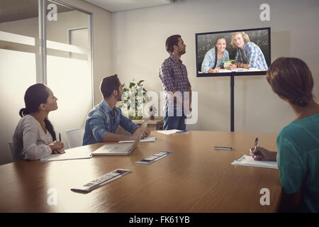Composite image of college students doing homework in library Stock Photo