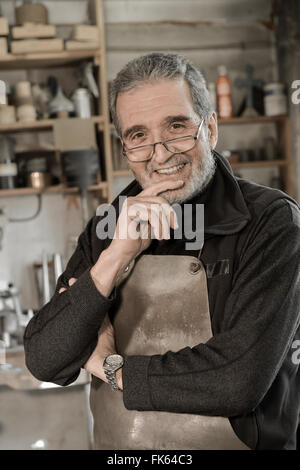Portrait Master goldsmith working in his workshop