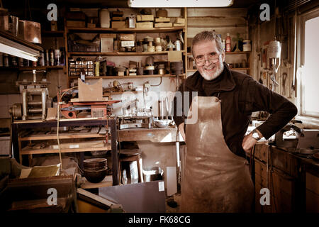Portrait Master goldsmith working in his workshop