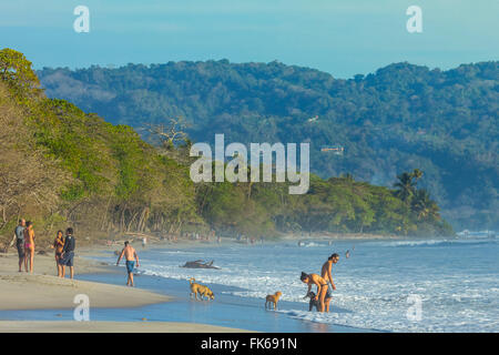 Beach walkers at this hip surf resort near Mal Pais, far south end of the Nicoya Peninsula, Santa Teresa, Puntarenas, Costa Rica Stock Photo