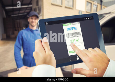 Composite image of man using tablet pc Stock Photo