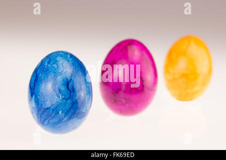 different colored easter eggs in a row Stock Photo