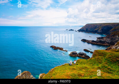 Couple on cliff top, Godrevy, Cornwall, England, United Kingdom, Europe Stock Photo