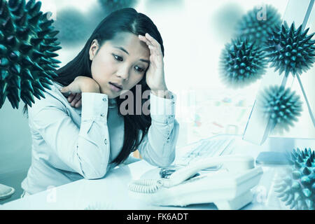 Composite image of unsmiling businesswoman with hands on face Stock Photo