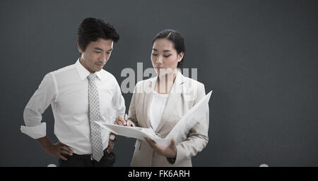 Composite image of estate agent showing lease to customer Stock Photo