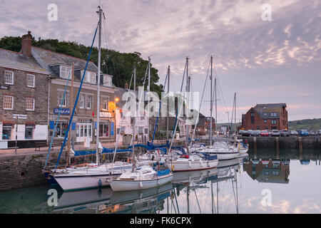 yachts moored at sunrise reflecting in water Stock Photo - Alamy