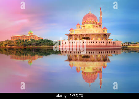 Sunset over Putrajaya Mosque and Panorama of Kuala Lumpur, Malaysia. Stock Photo