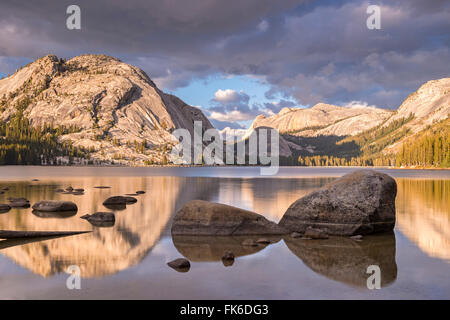 Granite mountains reflected in Tenaya Lake, Yosemite National Park, UNESCO, California, United States of America Stock Photo